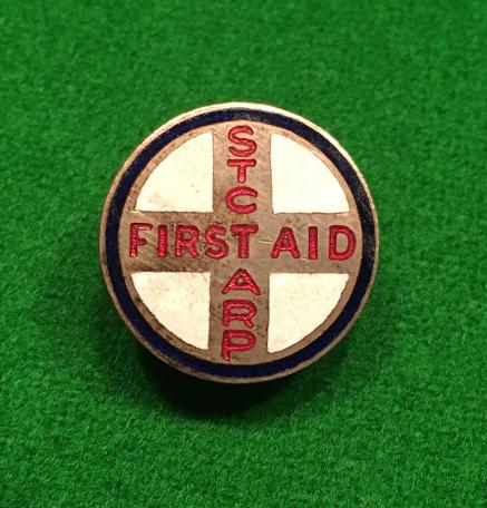 ARP First Aid lapel badge - Standard Telephones and Cables Ltd.