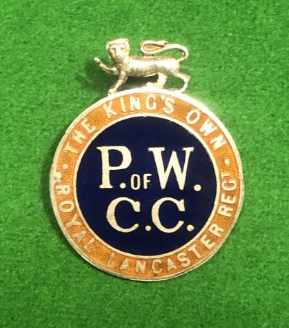 King's Own Regt. P.O.W. Comforts Committee Lapel Badge.