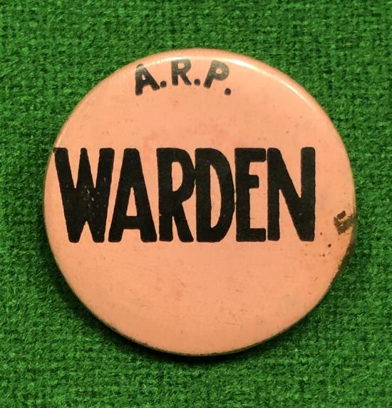 ARP ' Warden ' button badge.