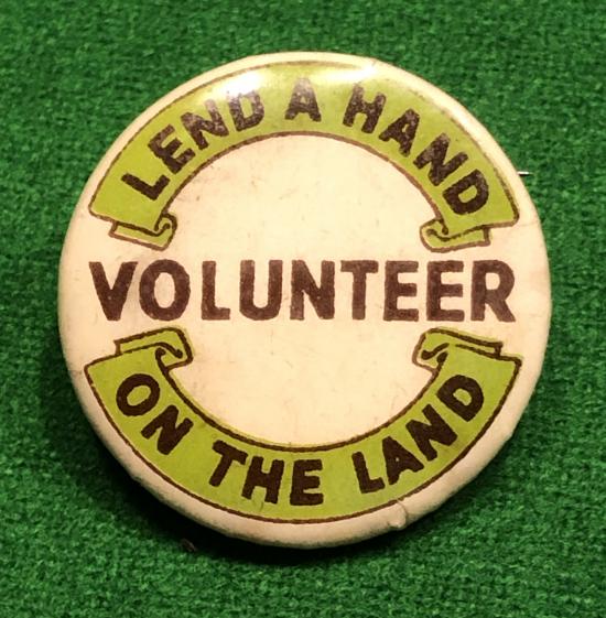 Lend a Hand on the Land lapel badge.