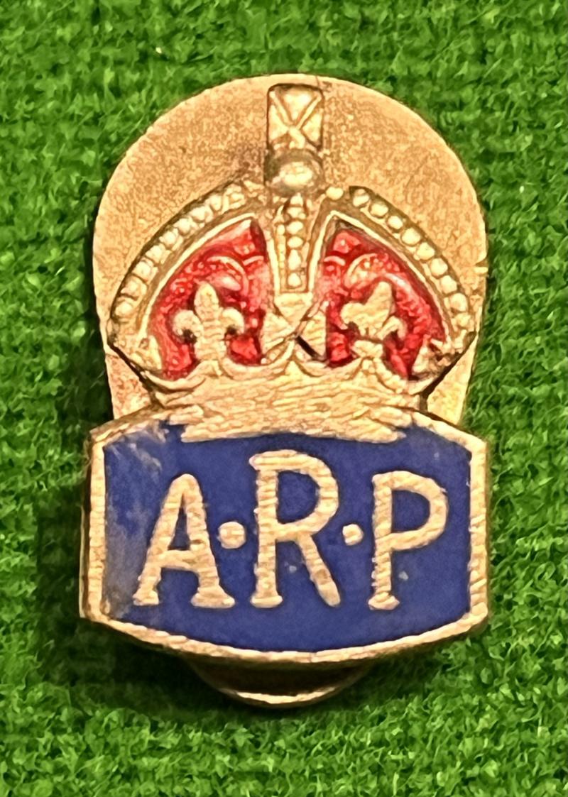 Quarter size ARP lapel badge.