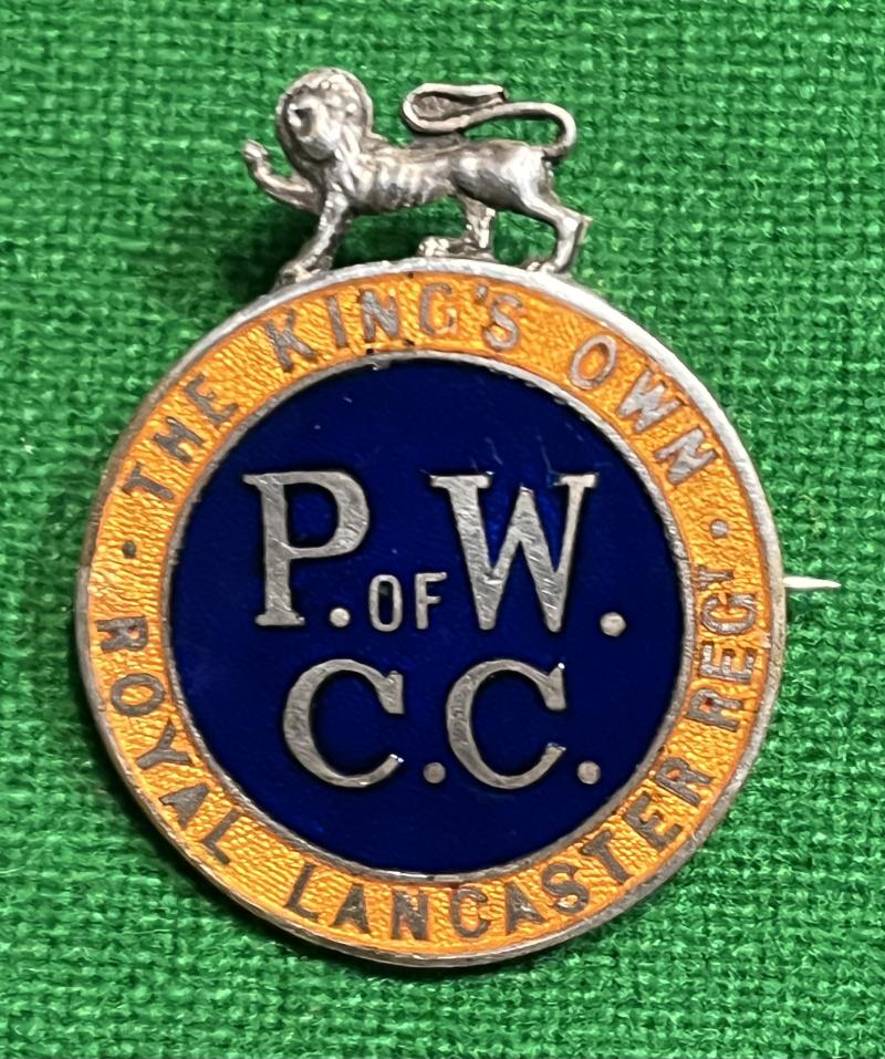 King's Own Regt. P.O.W. Comforts Committee Lapel Badge.