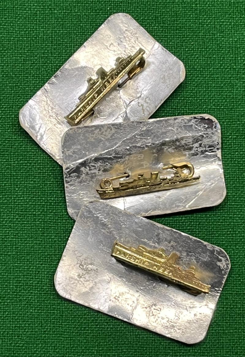 Warship Week pin badges.