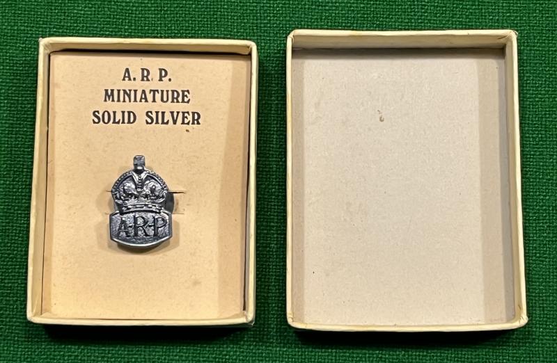 Boxed Silver ARP lapel badge.