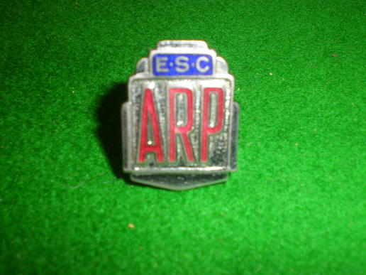 Factory ARP lapel badge.