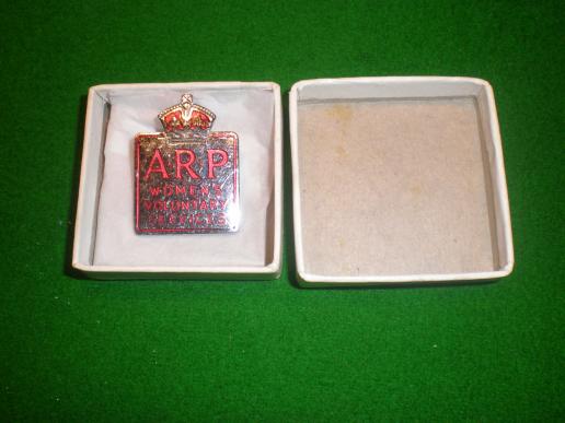Boxed WVS ARP badge.