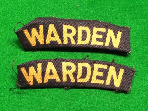 Printed Warden shoulder titles.