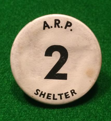 ARP Shelter pinback badge.