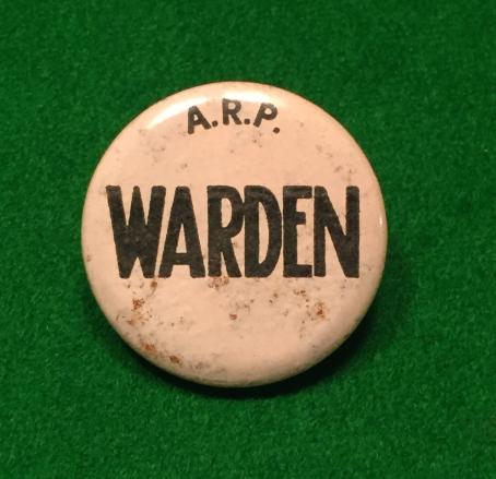 ARP ' Warden ' button badge.