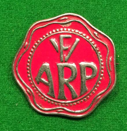 ' F.V. ' factory ARP badge.